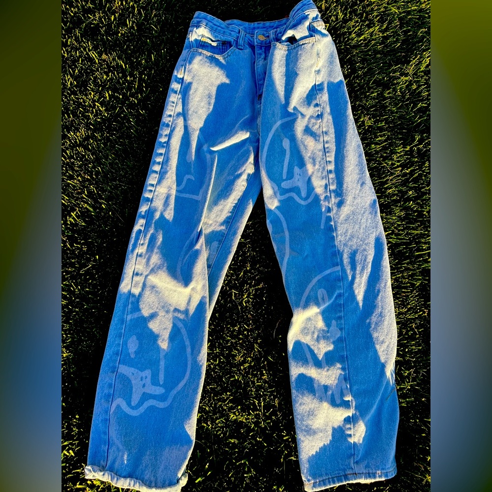 SHEIN jeans, size XS, slightly worn, fades smiley face print.